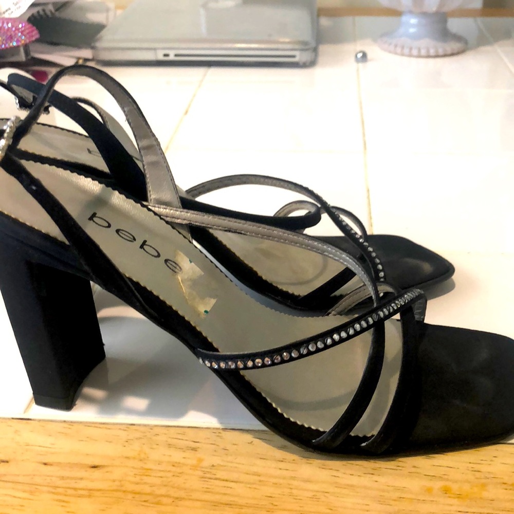 Black satin sandal with rhinestone detail.